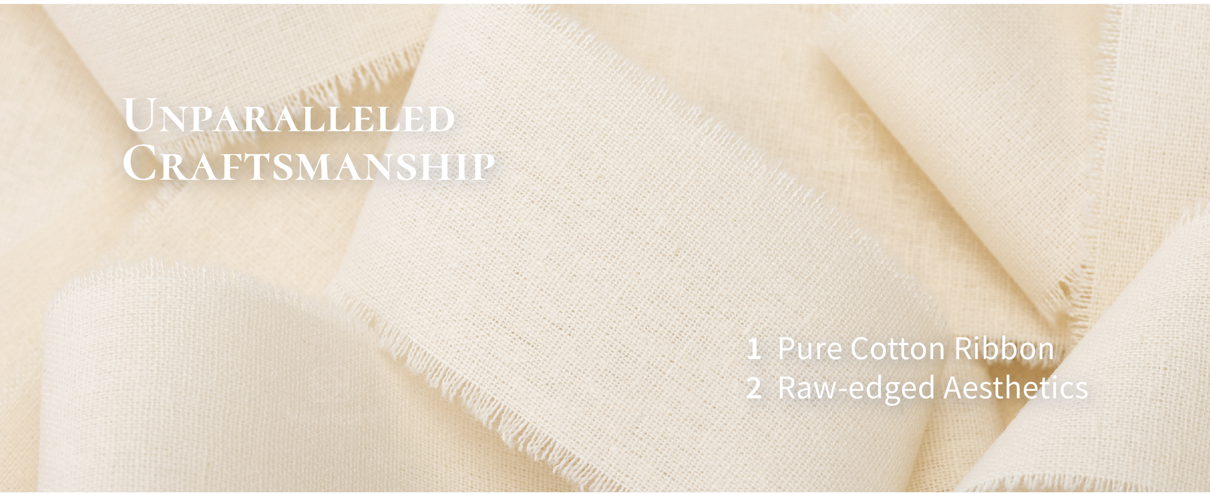 Close-up of cream-white cotton ribbon showing its fine woven texture and softly fringed raw edges.
