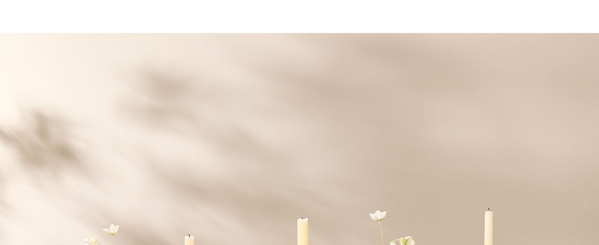 Black frayed cotton ribbon tied around a flower vase and styled as a bow in a brunette updo