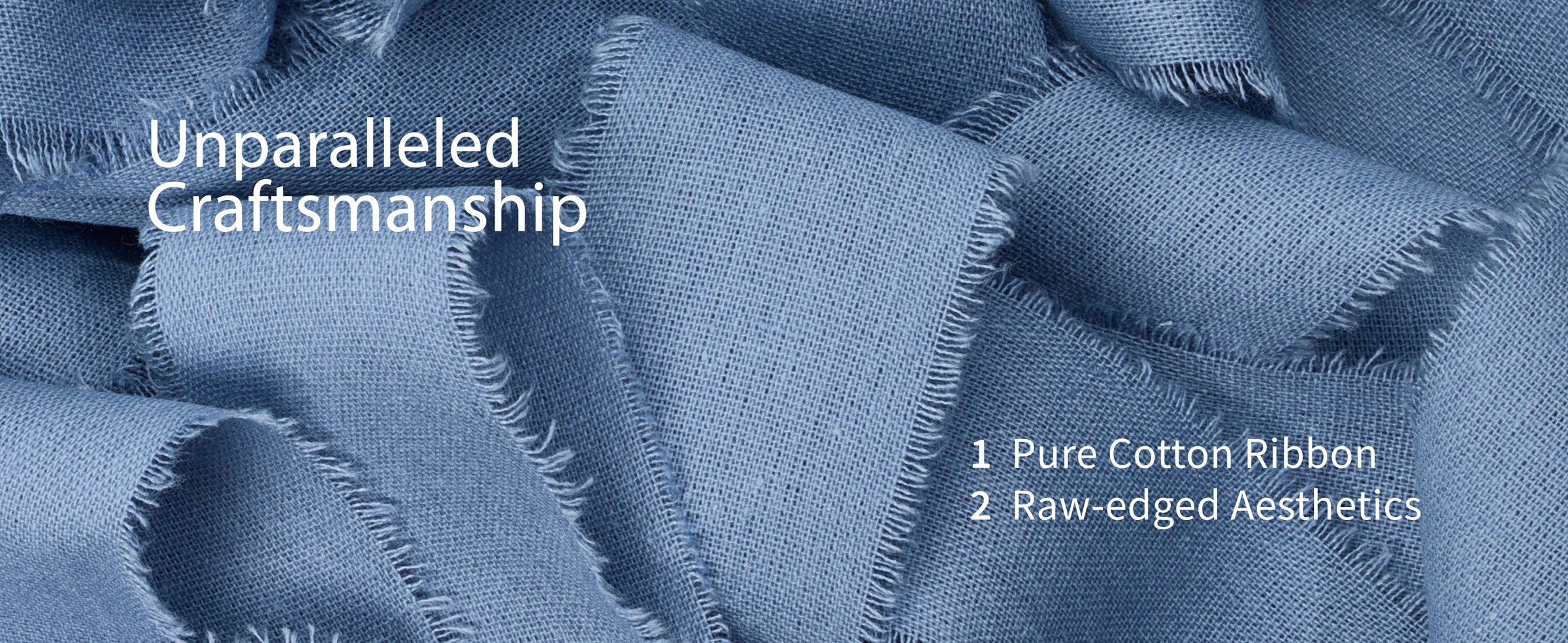 Close-up of dusty blue cotton ribbon with a fine woven texture and softly frayed raw edges.