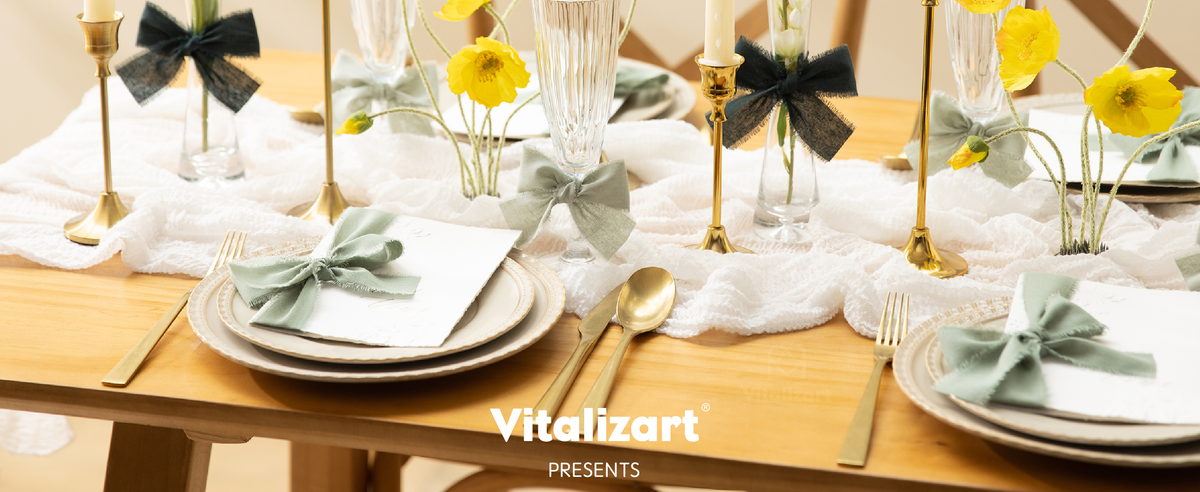 Green cotton ribbon bows decorate glasses, vases, and place settings on a floral dining table.