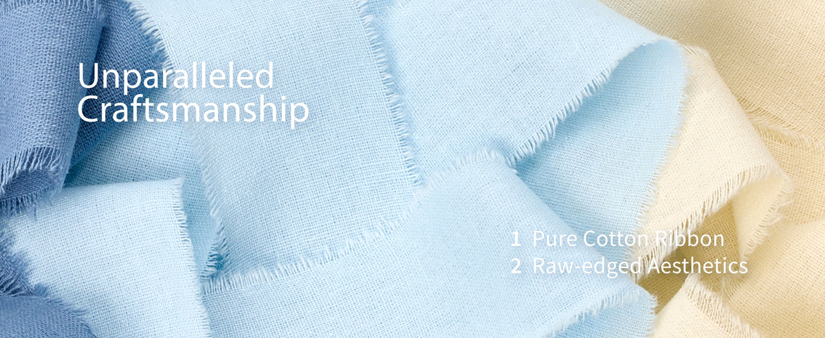 Cream, light blue, and dark blue frayed cotton ribbons displayed on pale wooden spools with natural grain.