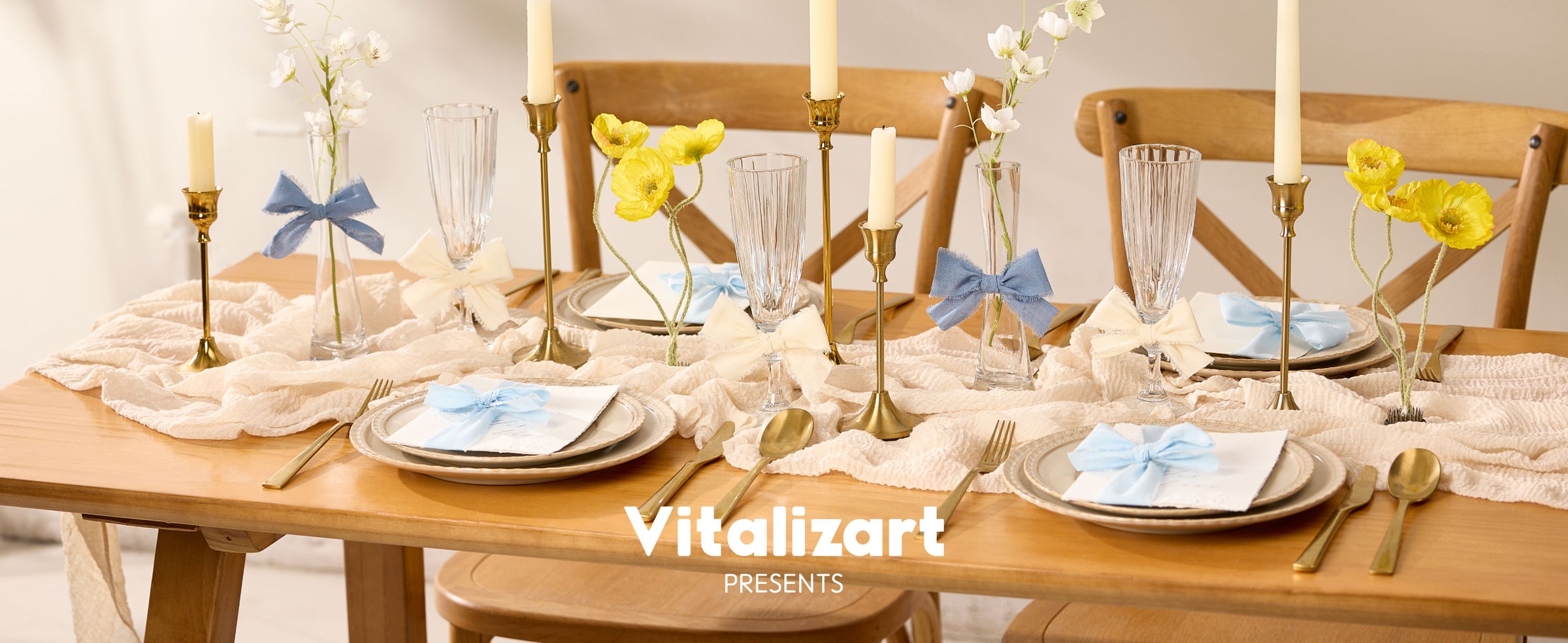 Blue and cream cotton ribbon bows decorating napkins, glasses, and vases on a dining table