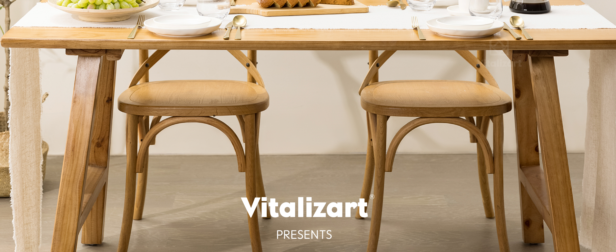 Ivory fringed table runner across a warmly lit wooden dining table set for two