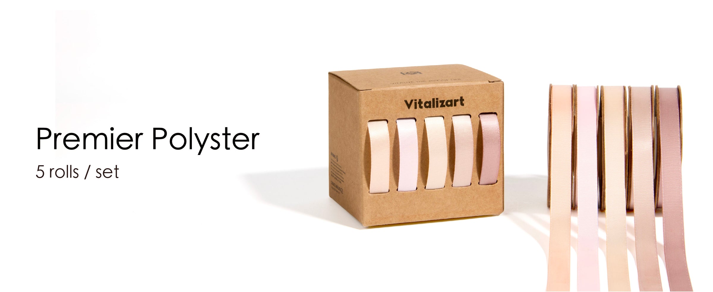 Five pale neutral satin ribbon rolls and a kraft dispenser, with cream, pink, peach, and dusty rose lengths.