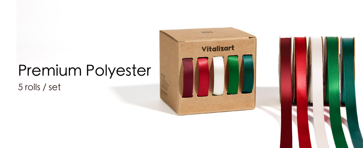 Close-up of green, white, burgundy, and coral satin ribbon threads illustrating yarn-dyed construction.
