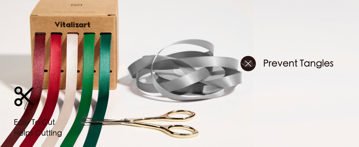 Kraft satin ribbon storage boxes and cardboard inserts displayed in warm sunlight.
