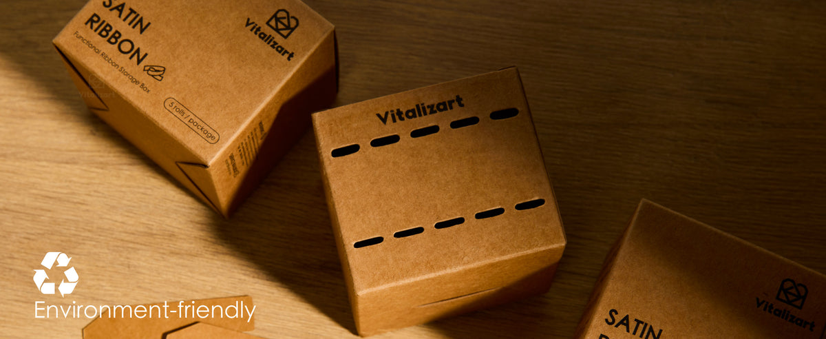 Kraft satin ribbon storage boxes and flat cardboard inserts displayed on a wooden table