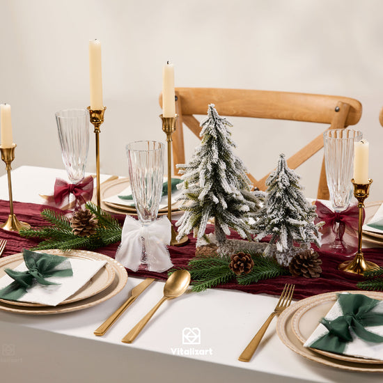 White, red and green chiffon ribbon set on wooden spools