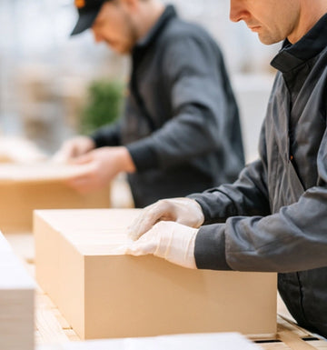 Workers inspecting and packing wholesale orders