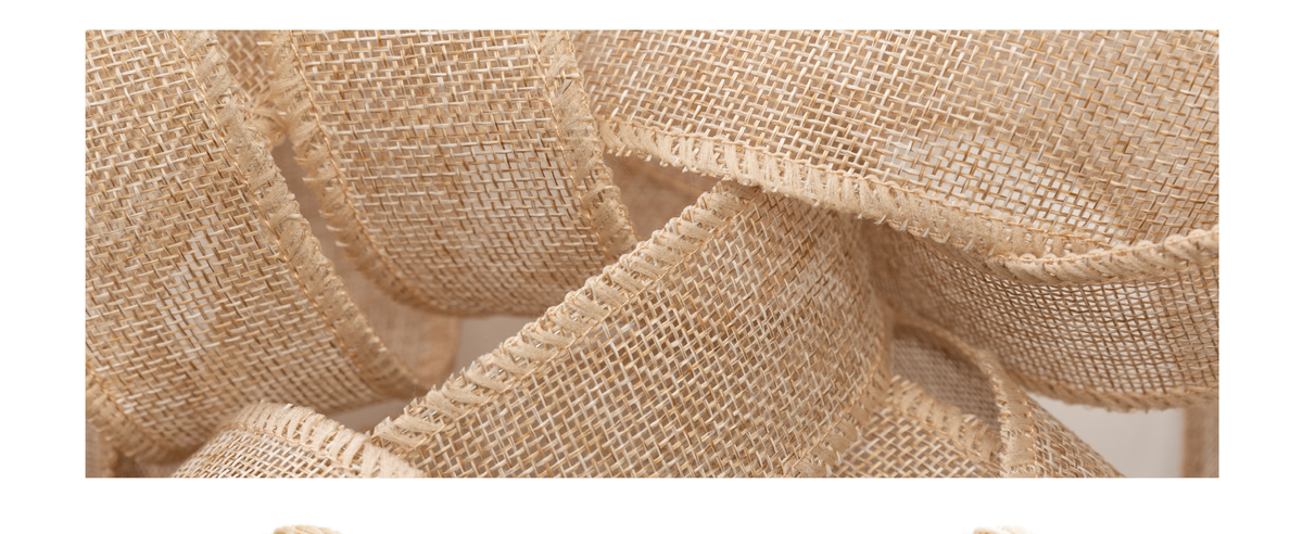 Close-up of beige wired burlap ribbon loops with open weave and reinforced edges