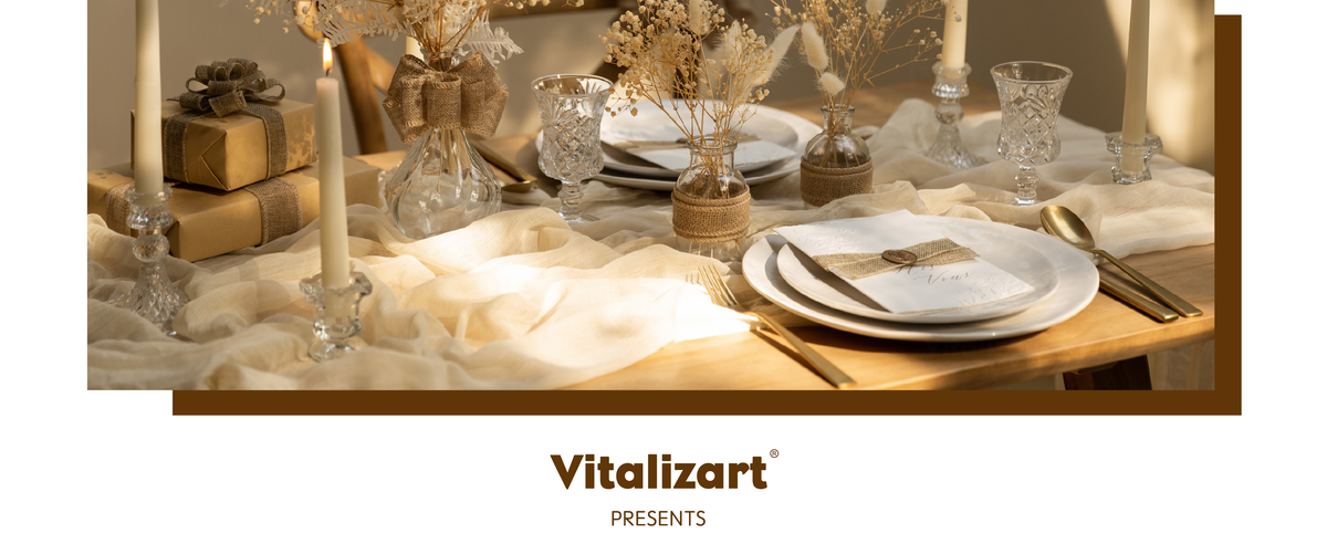 Beige burlap ribbon accents gifts and flower vases on a candlelit neutral table setting.