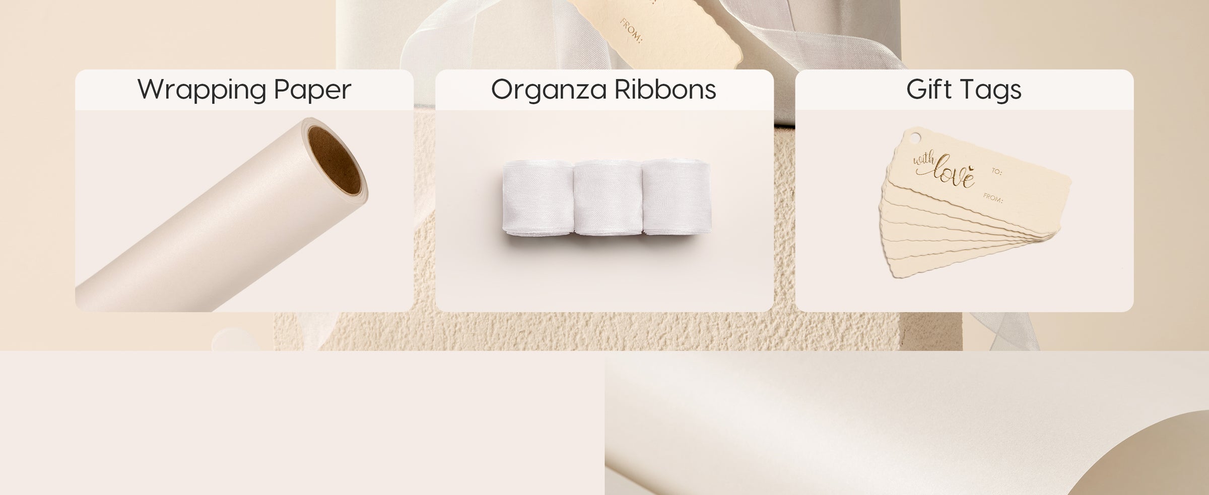 White pearly wrapping set with a paper roll, three organza ribbons, and cream gift tags