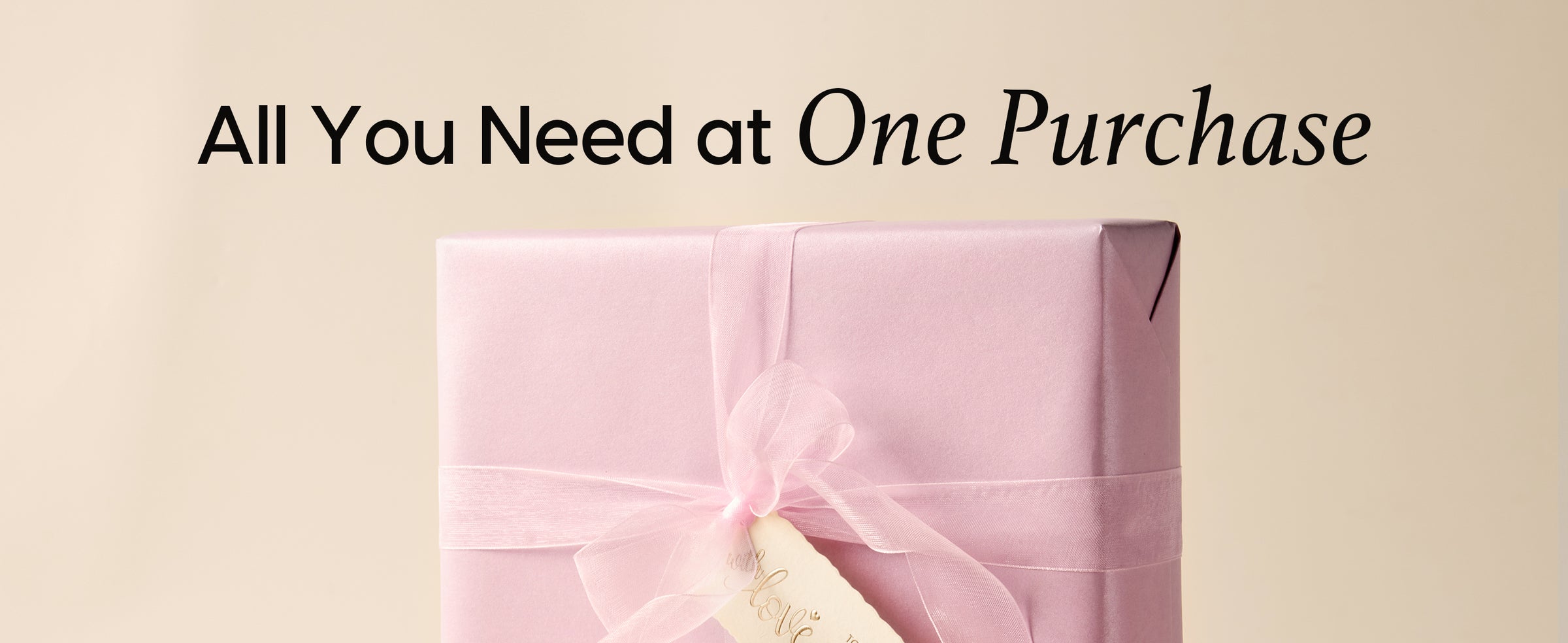 Blush pink pearly wrapping paper set presented with coordinated ribbon and gift tags in one package