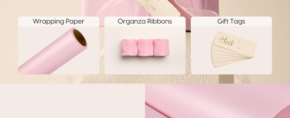 Blush pink pearly wrapping paper roll with organza ribbon and matching gift tags