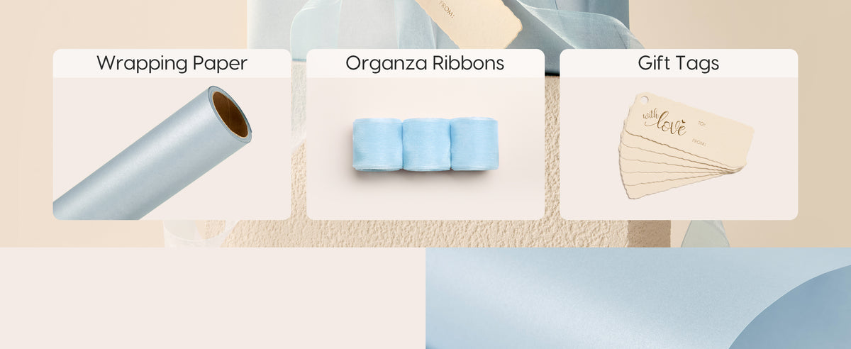 Baby blue pearly wrapping paper set with wrapping paper roll, organza ribbon, and matching gift tags