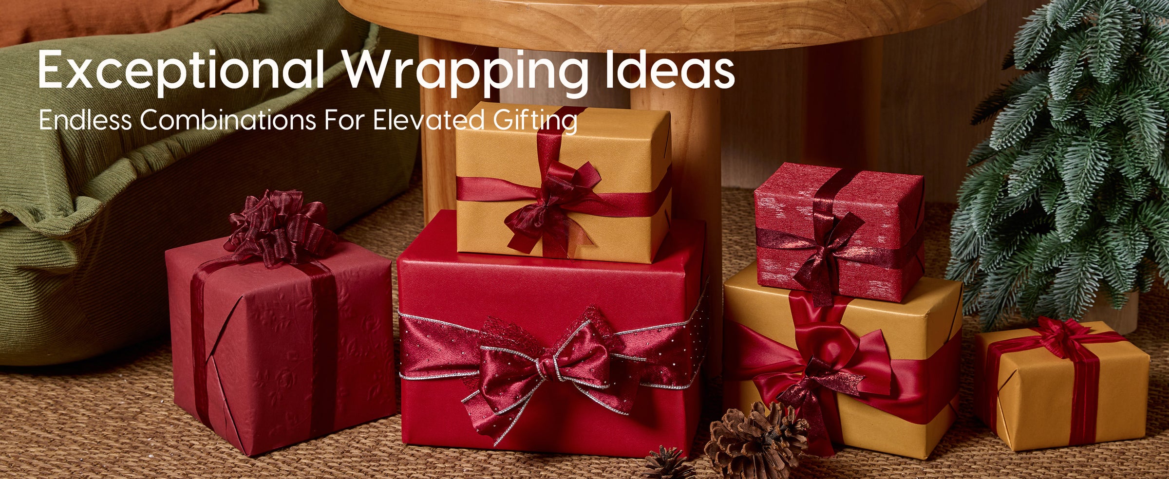 Red and gold gift boxes with varied ribbon bows arranged in a festive room with miniature evergreens