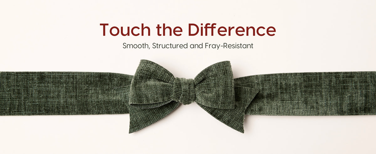 Close-up of an olive-green textured velvet ribbon tied into a structured layered bow