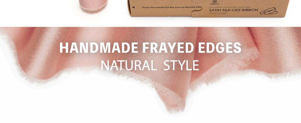 Light pink satin ribbon in soft folds, showing its lustrous surface and handmade frayed edges.