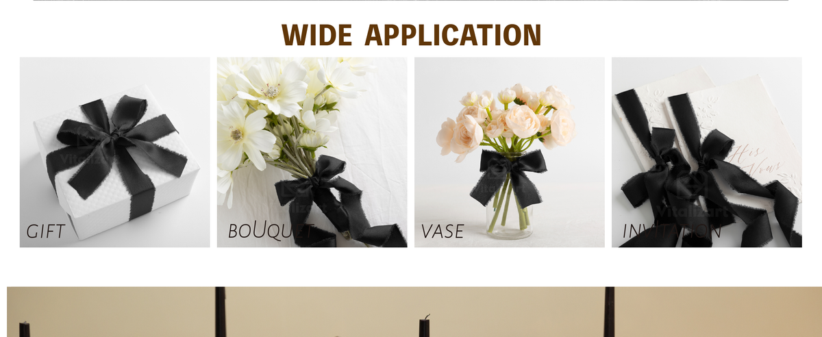 Black frayed satin ribbon bows decorating a flower vase and embossed white invitations