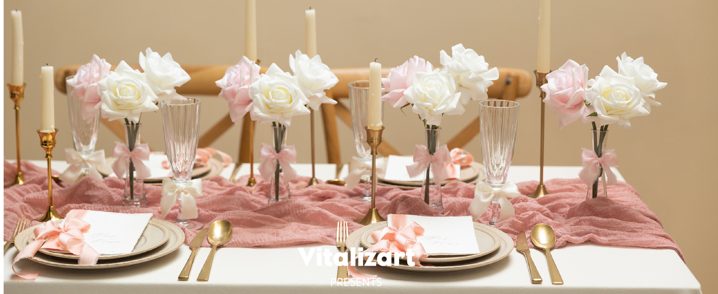Pink and cream frayed ribbon bows decorate glasses, flower vases, and place settings on a dining table