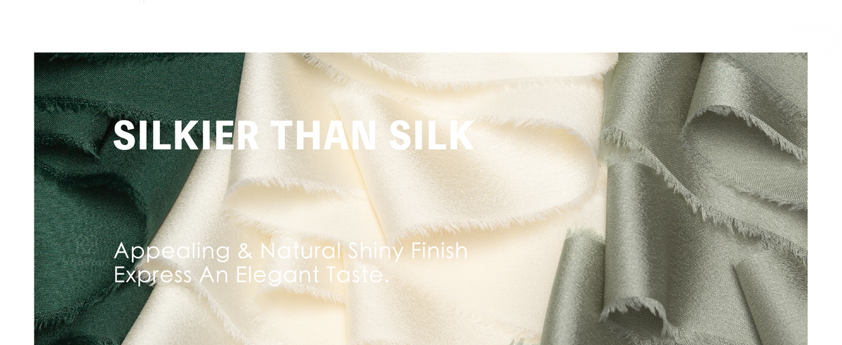 Green, cream, and sage frayed satin ribbon used for gift box bows and a white floral bouquet
