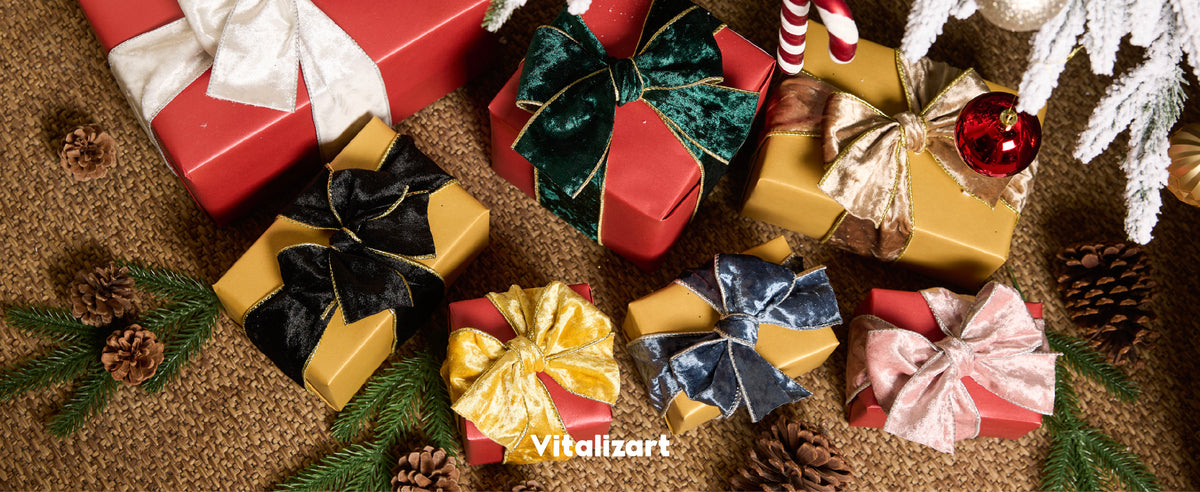 Dusty blue velvet ribbon decorating a gift, garland, stair rail, and Christmas wreath