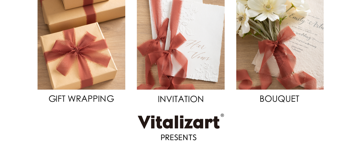 Rust-red frayed chiffon ribbon decorates kraft gifts, white invitations, and a white flower bouquet.