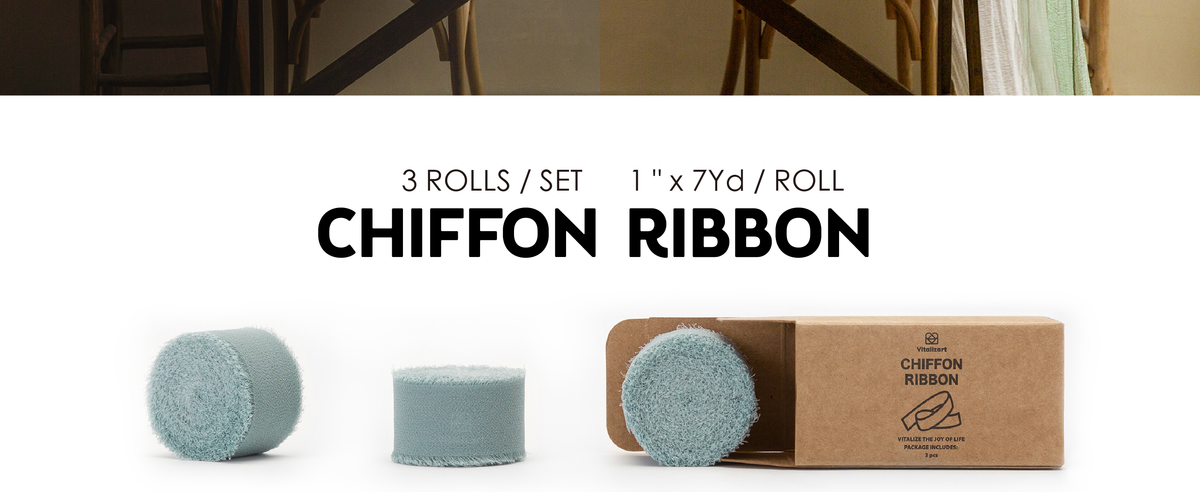 Three dusty blue 1-inch chiffon ribbon rolls with frayed edges, shown beside their kraft box.