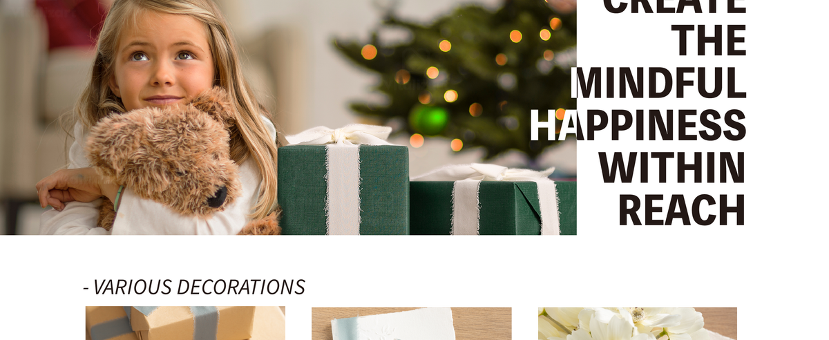 Pale blue chiffon ribbon wraps a green gift beside a child hugging a plush dog near a decorated tree.