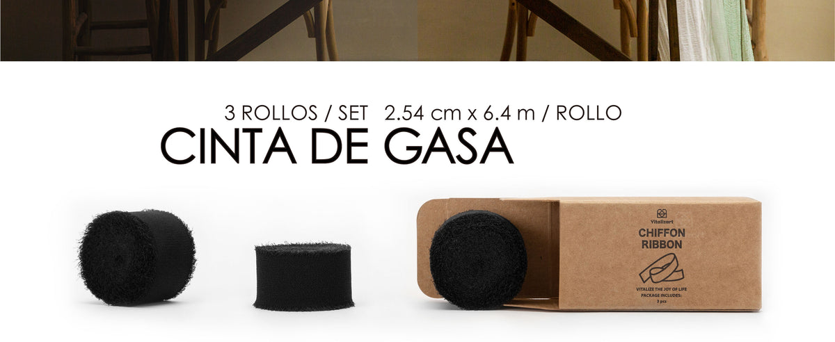 Three black chiffon ribbon rolls with frayed edges beside an open kraft package