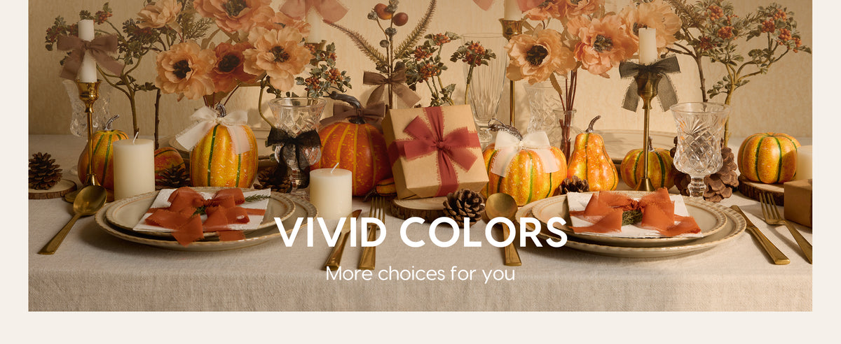 Colorful chiffon ribbon bows decorate an autumn table with pumpkins, flowers, candles, and gifts.