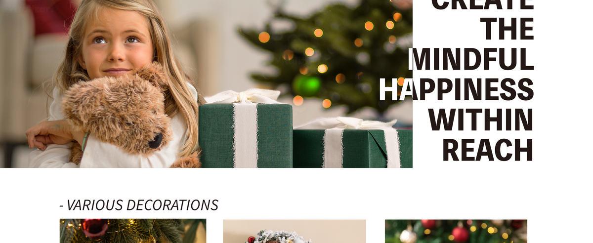 Girl hugging a plush dog beside a green gift box wrapped with white chiffon ribbon